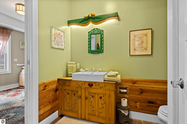 203 W 2nd St, Elk Rapids, MI 49629 - bathroom featuring toilet and vanity