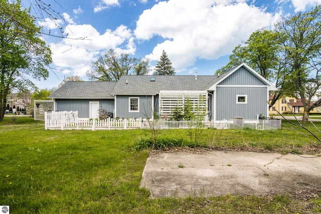 203 W 2nd St, Elk Rapids, MI 49629 - back of property with a shingled roof
