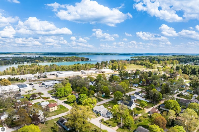 203 W 2nd St, Elk Rapids, MI 49629 - drone / aerial view of a nearby body of water and a tree filled landscape