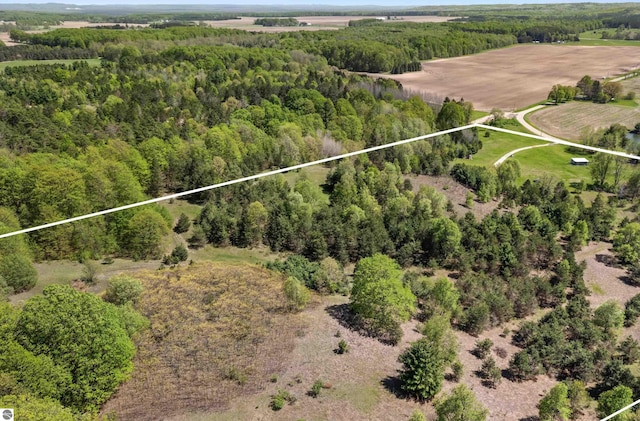 view of property location with property parcel outlined and a forest