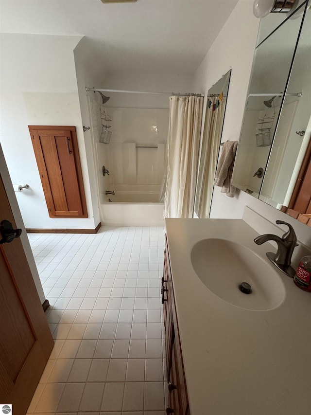 full bath featuring tile patterned floors, vanity, and shower / bath combo with shower curtain