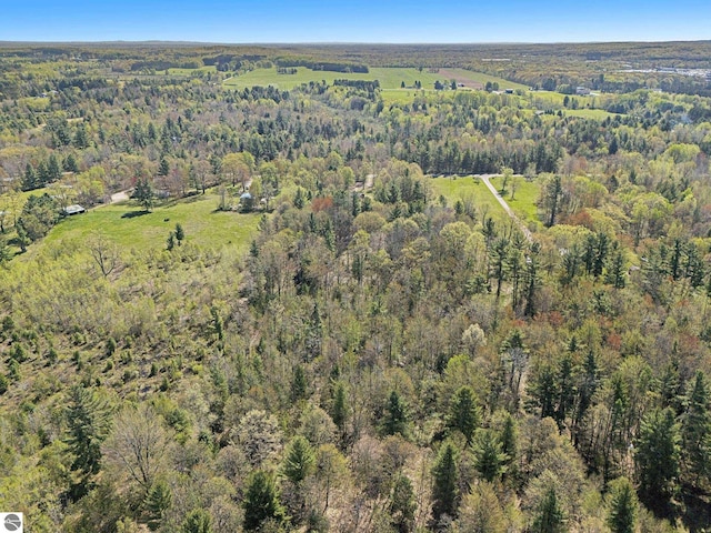 3218 S 41st Rd, Cadillac, MI 49601 - aerial view of property and surrounding area featuring a heavily wooded area