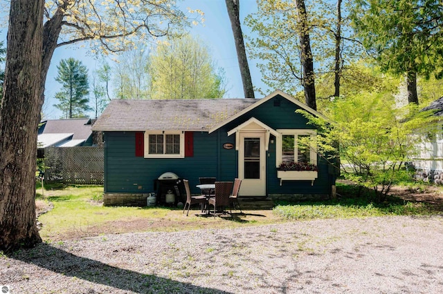 429 S Shabwasung St, Northport, MI 49670 - bungalow with entry steps and fence