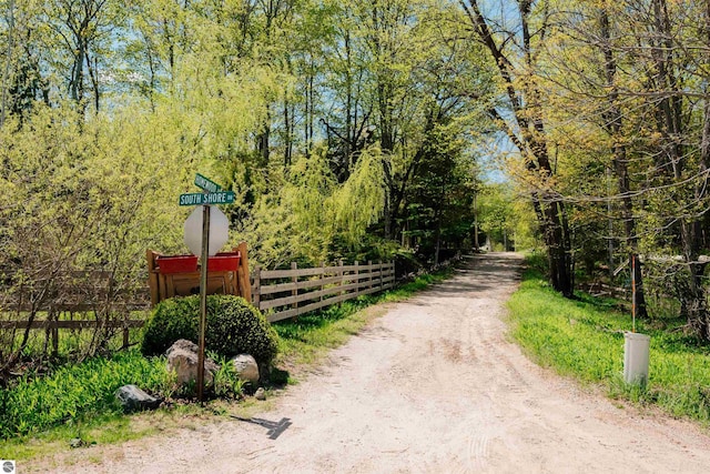 429 S Shabwasung St, Northport, MI 49670 - view of street featuring a wooded view
