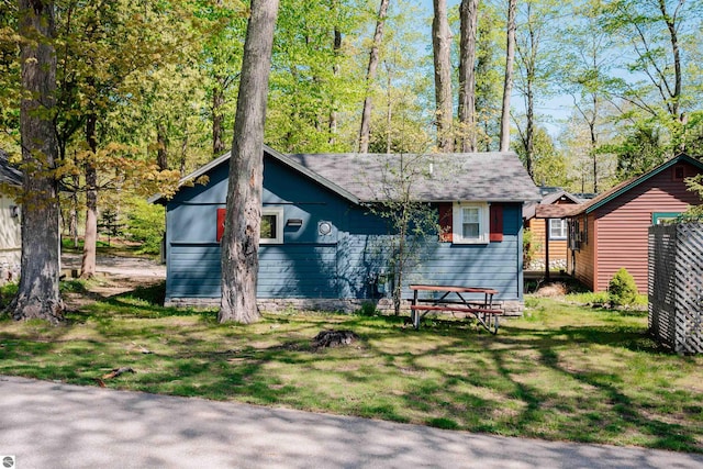429 S Shabwasung St, Northport, MI 49670 - view of front of home featuring a front lawn