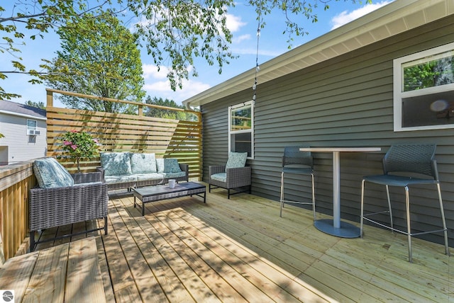 wooden deck with an outdoor hangout area