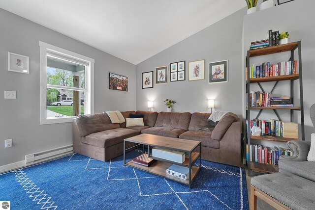 carpeted living room featuring vaulted ceiling, a baseboard heating unit, and baseboards