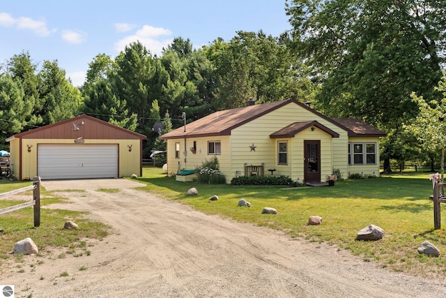 6202 Fletcher Rd, Fife Lake, MI 49633 - view of front of home with an outbuilding and a detached garage