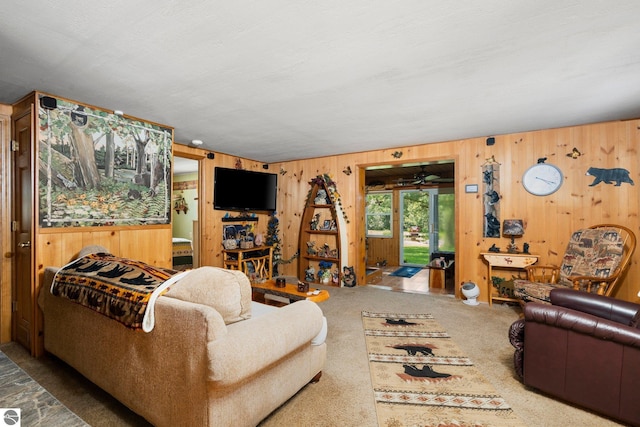 6202 Fletcher Rd, Fife Lake, MI 49633 - carpeted living room with wooden walls