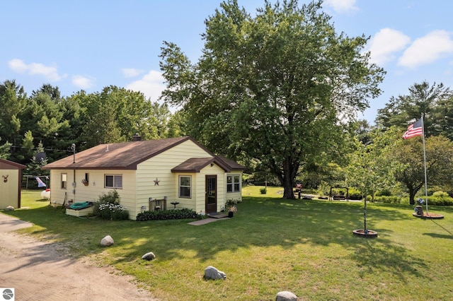 6202 Fletcher Rd, Fife Lake, MI 49633 - view of side of property featuring a lawn