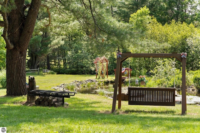 6202 Fletcher Rd, Fife Lake, MI 49633 - surrounding community featuring a yard