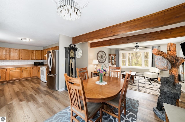 4480 Mockingbird Cir, Farwell, MI 48622 - dining room with wood finished floors, ceiling fan, a chandelier, and beamed ceiling