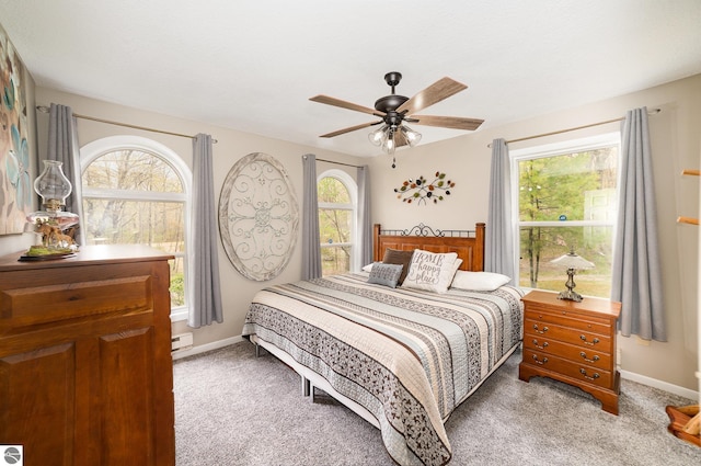 4480 Mockingbird Cir, Farwell, MI 48622 - bedroom featuring multiple windows, light carpet, and baseboards