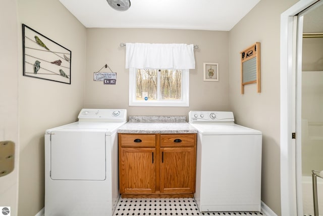 4480 Mockingbird Cir, Farwell, MI 48622 - laundry area featuring separate washer and dryer and cabinet space