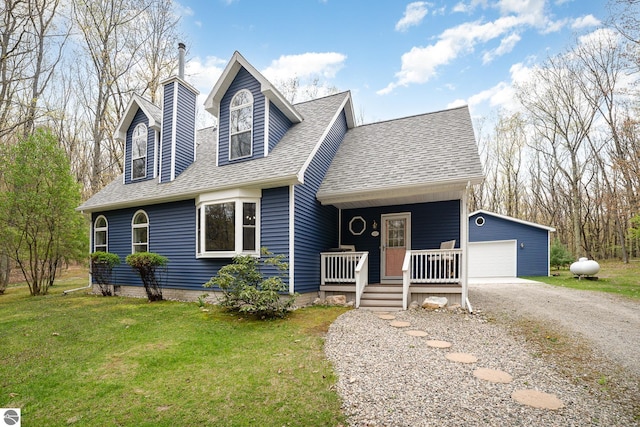 4480 Mockingbird Cir, Farwell, MI 48622 - view of front of house with an outdoor structure, a shingled roof, a porch, a front yard, and a detached garage