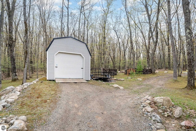 4480 Mockingbird Cir, Farwell, MI 48622 - garage with a storage unit