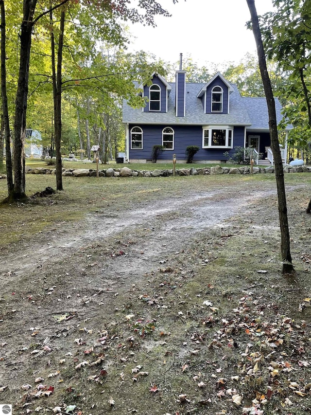 4480 Mockingbird Cir, Farwell, MI 48622 - view of front of home with roof with shingles and a chimney