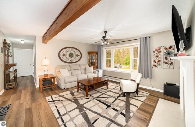 4480 Mockingbird Cir, Farwell, MI 48622 - living area featuring wood finished floors, baseboards, a ceiling fan, and beamed ceiling