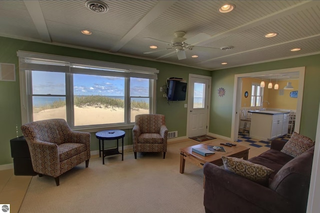 14463 Cathead Bay Dr, Northport, MI 49670 - living area featuring baseboards, ceiling fan, recessed lighting, and light carpet