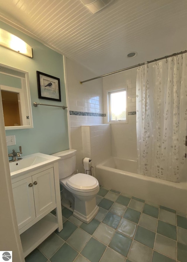 14463 Cathead Bay Dr, Northport, MI 49670 - full bath with shower / tub combo with curtain, toilet, vanity, and tile patterned flooring