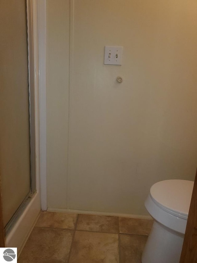 5232 E Broadway Lot 338, Mount Pleasant, MI 48858 - bathroom with toilet, baseboards, and tile patterned flooring