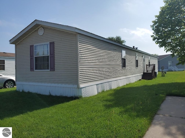 5232 E Broadway Lot 338, Mount Pleasant, MI 48858 - view of home's exterior with a yard