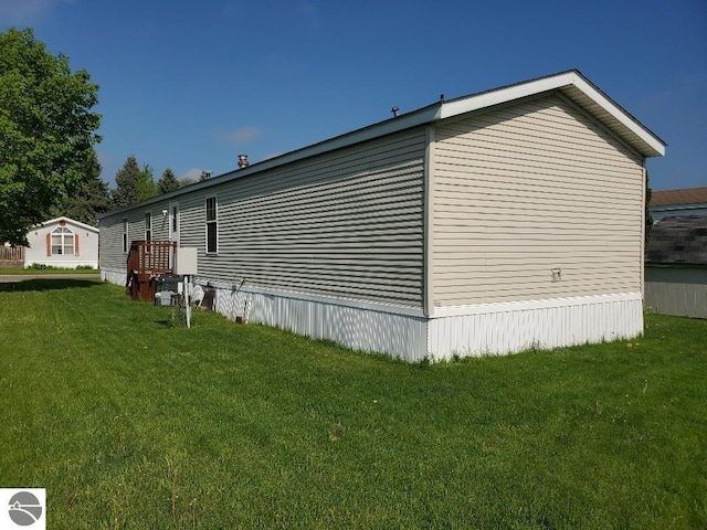 5232 E Broadway Lot 338, Mount Pleasant, MI 48858 - view of side of property featuring a yard