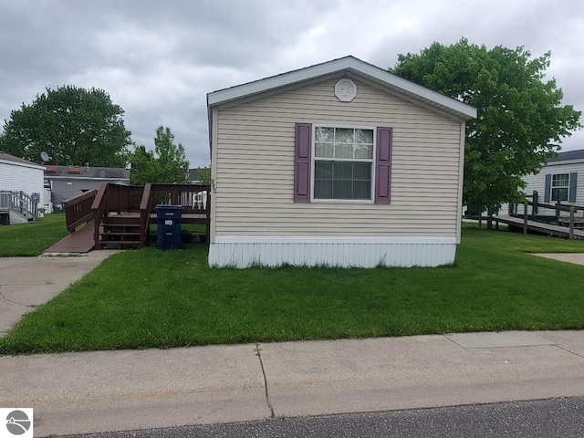 5232 E Broadway Lot 338, Mount Pleasant, MI 48858 - view of property exterior featuring a deck