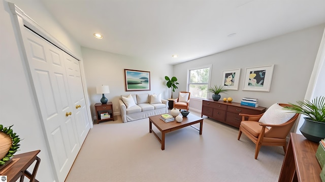 carpeted living room with recessed lighting and baseboards