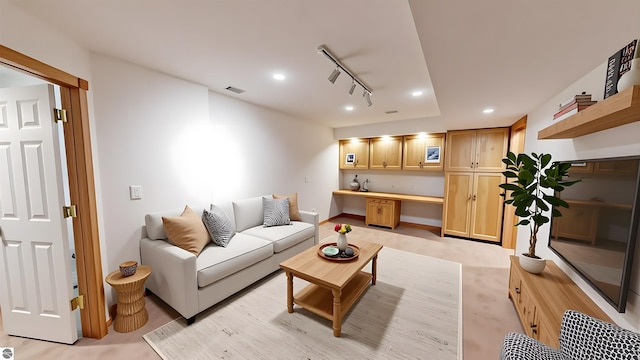 living room with track lighting, recessed lighting, and bar