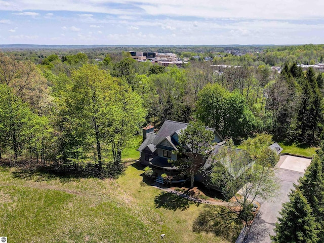 view from above of property featuring a forest