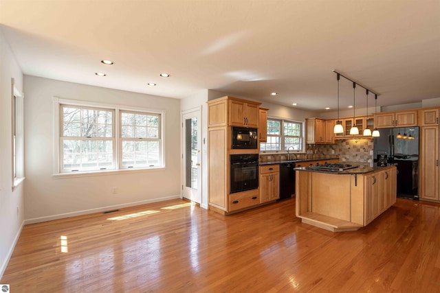 kitchen with black appliances, dark countertops, rail lighting, decorative backsplash, and baseboards