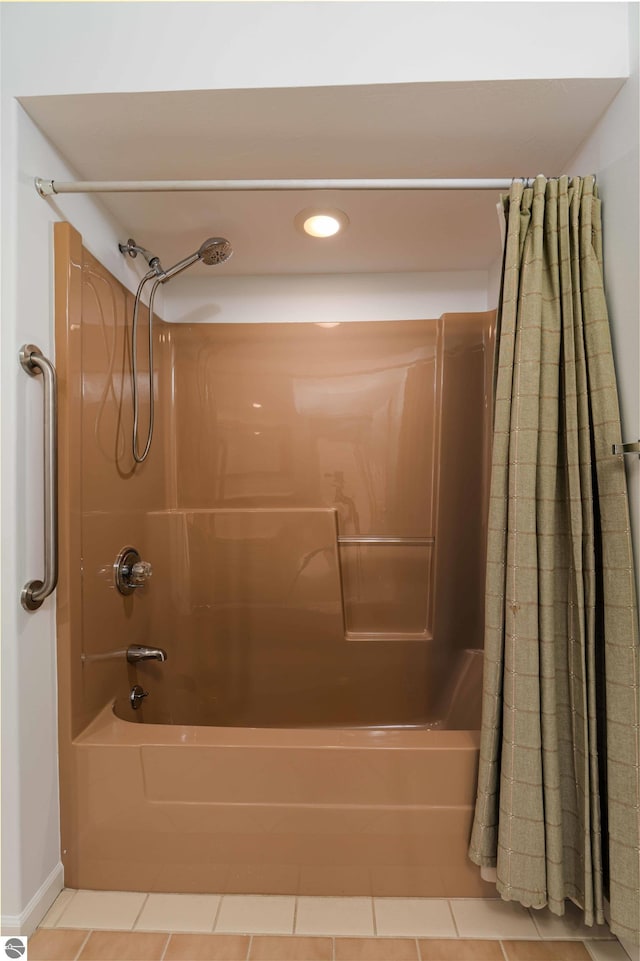 bathroom featuring shower / bath combo with shower curtain, tile patterned flooring, and recessed lighting