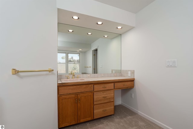 bathroom featuring recessed lighting, baseboards, and vanity