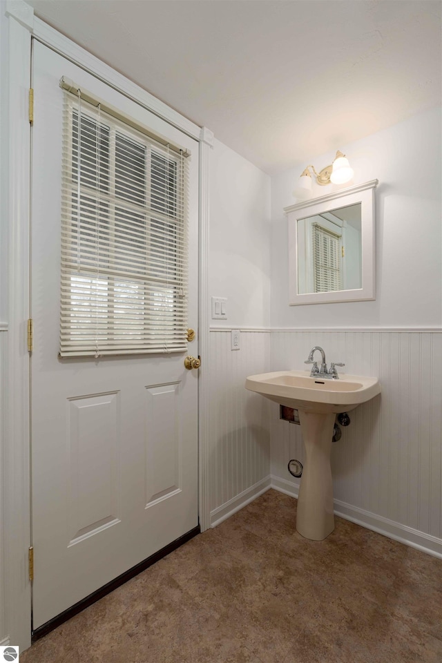 bathroom featuring a wainscoted wall