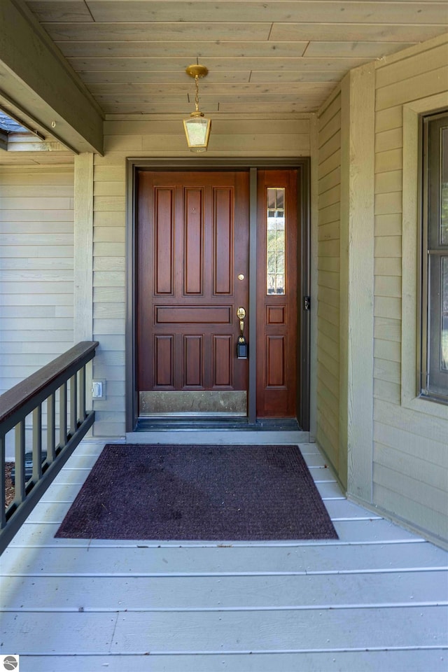 property entrance featuring covered porch