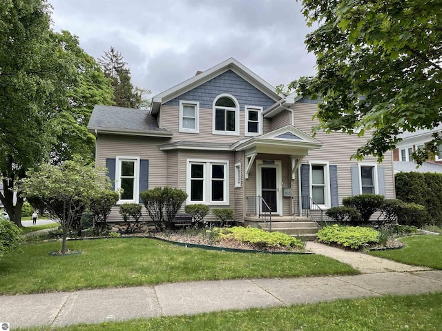 630 N State St, Alma, MI 48801 - view of front of home with a front yard