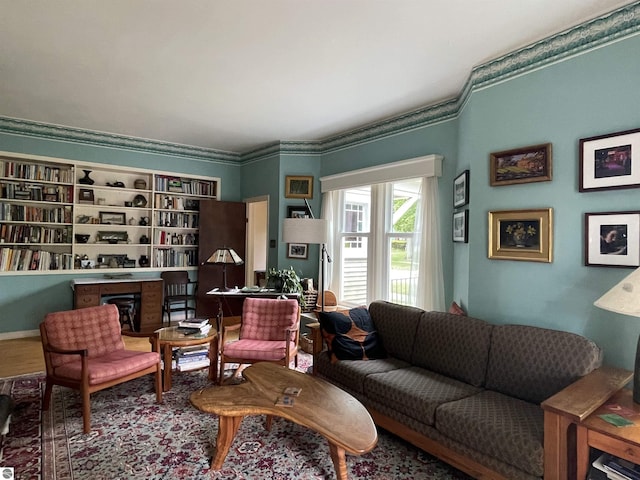 630 N State St, Alma, MI 48801 - living area featuring a fireplace and ornamental molding