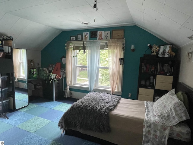 630 N State St, Alma, MI 48801 - bedroom with tile patterned floors and lofted ceiling