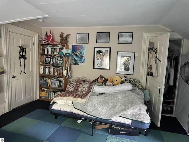 630 N State St, Alma, MI 48801 - bedroom featuring vaulted ceiling and tile patterned floors