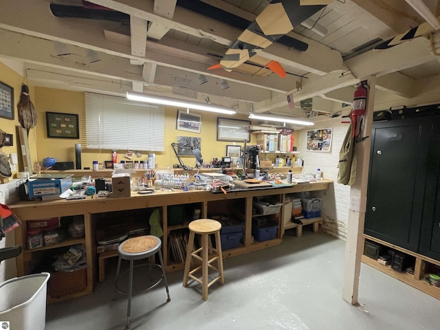 630 N State St, Alma, MI 48801 - misc room featuring a workshop area and finished concrete flooring