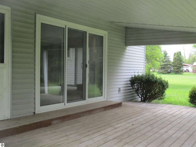 8481 N Luce Rd, Alma, MI 48801 - wooden terrace featuring a lawn
