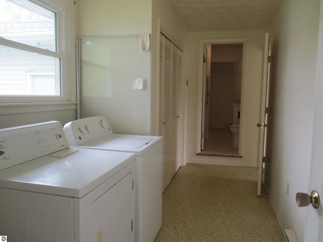 8481 N Luce Rd, Alma, MI 48801 - washroom with washer and clothes dryer, healthy amount of natural light, light carpet, and baseboards