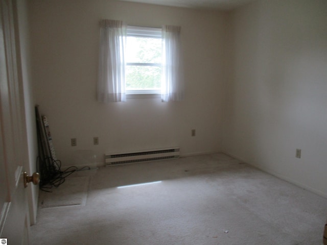 8481 N Luce Rd, Alma, MI 48801 - carpeted spare room featuring baseboard heating