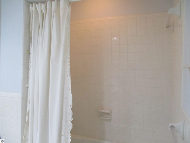 8481 N Luce Rd, Alma, MI 48801 - full bathroom with shower / tub combo with curtain and tile walls