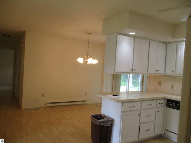 8481 N Luce Rd, Alma, MI 48801 - kitchen featuring a baseboard heating unit, white dishwasher, white cabinetry, a peninsula, and light wood-type flooring