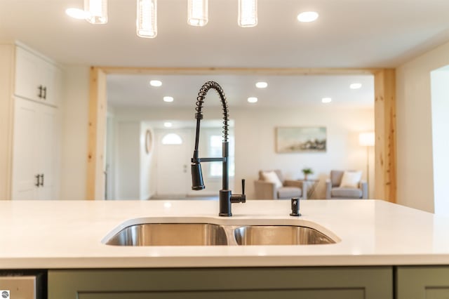 968 Barlow St, Traverse City, MI 49686 - kitchen with a sink, light countertops, recessed lighting, gray cabinetry, and white cabinets
