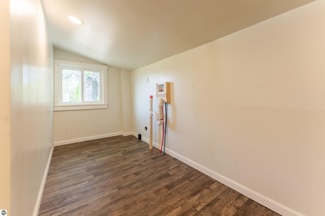 968 Barlow St, Traverse City, MI 49686 - empty room with lofted ceiling, dark wood-type flooring, baseboards, and recessed lighting