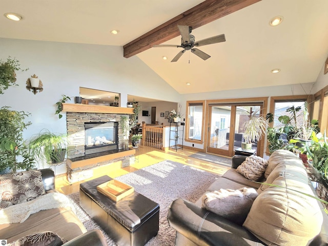 205 S Elm St, Suttons Bay, MI 49682 - living room with beamed ceiling, wood finished floors, recessed lighting, a ceiling fan, and a fireplace