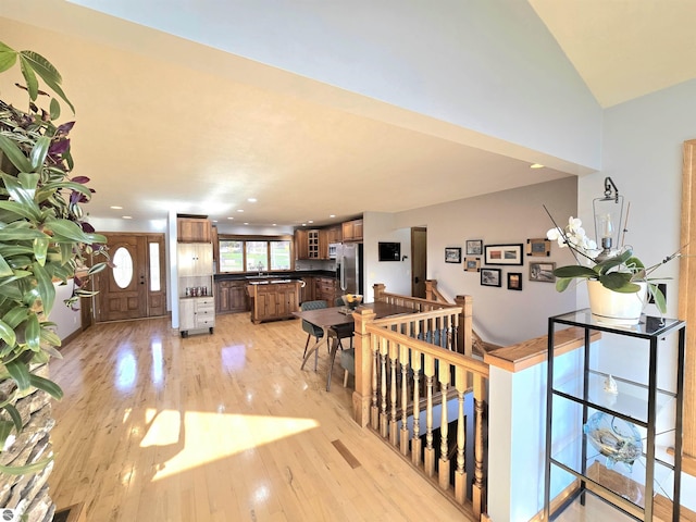 205 S Elm St, Suttons Bay, MI 49682 - entryway with light wood-style floors, recessed lighting, and lofted ceiling
